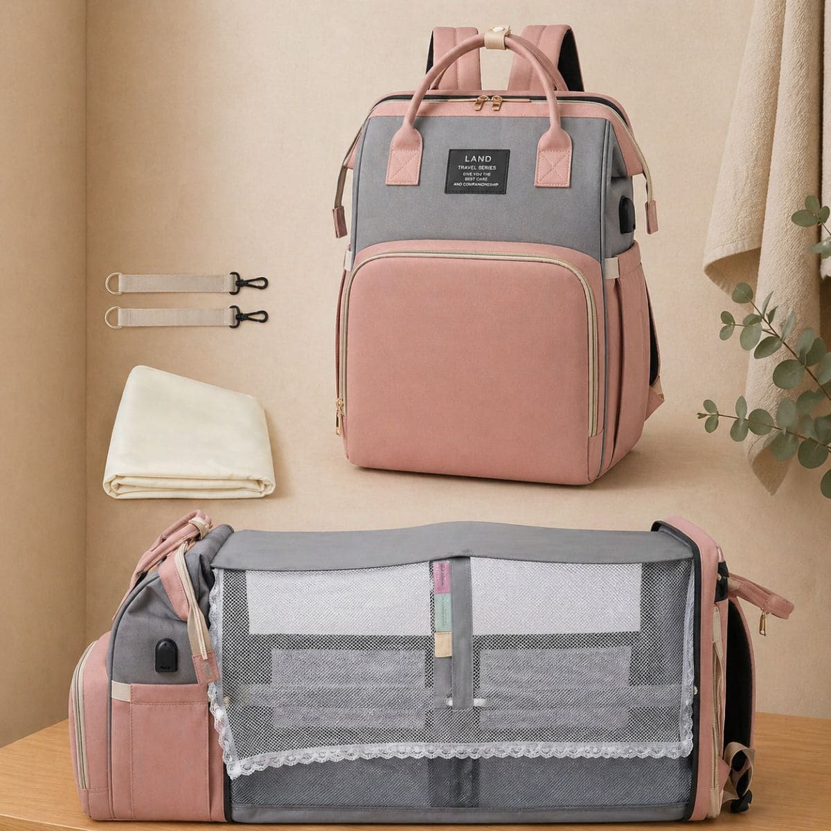 Sac à dos à langer Nid Nomade avec lit intégré déplié pour bébé couleur rose et gris 