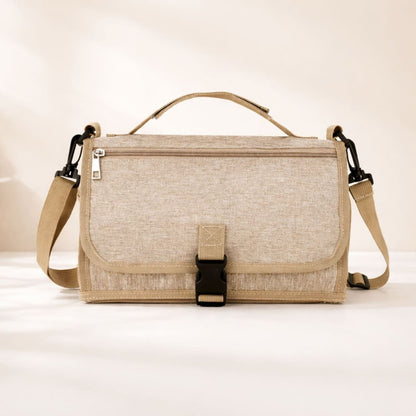 Tapis à langer nomade Nomade+  beige pliable avec compartiment de rangement pour sorties avec bébé 